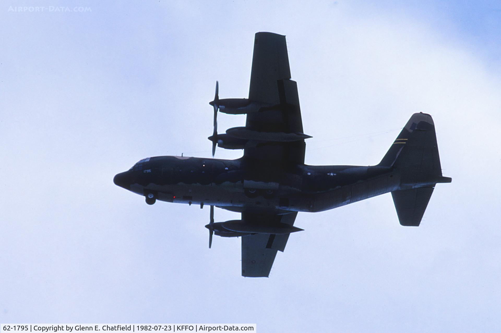 62-1795, 1962 Lockheed C-130E Hercules C/N 382-3746, Final approach, passing over the highway at the east end of the base.