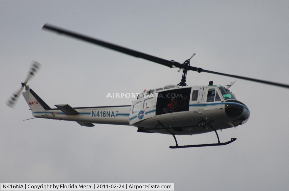 N416NA, Bell UH-1B C/N 622064, NASA UH-1B flying over Indian River at Titusville