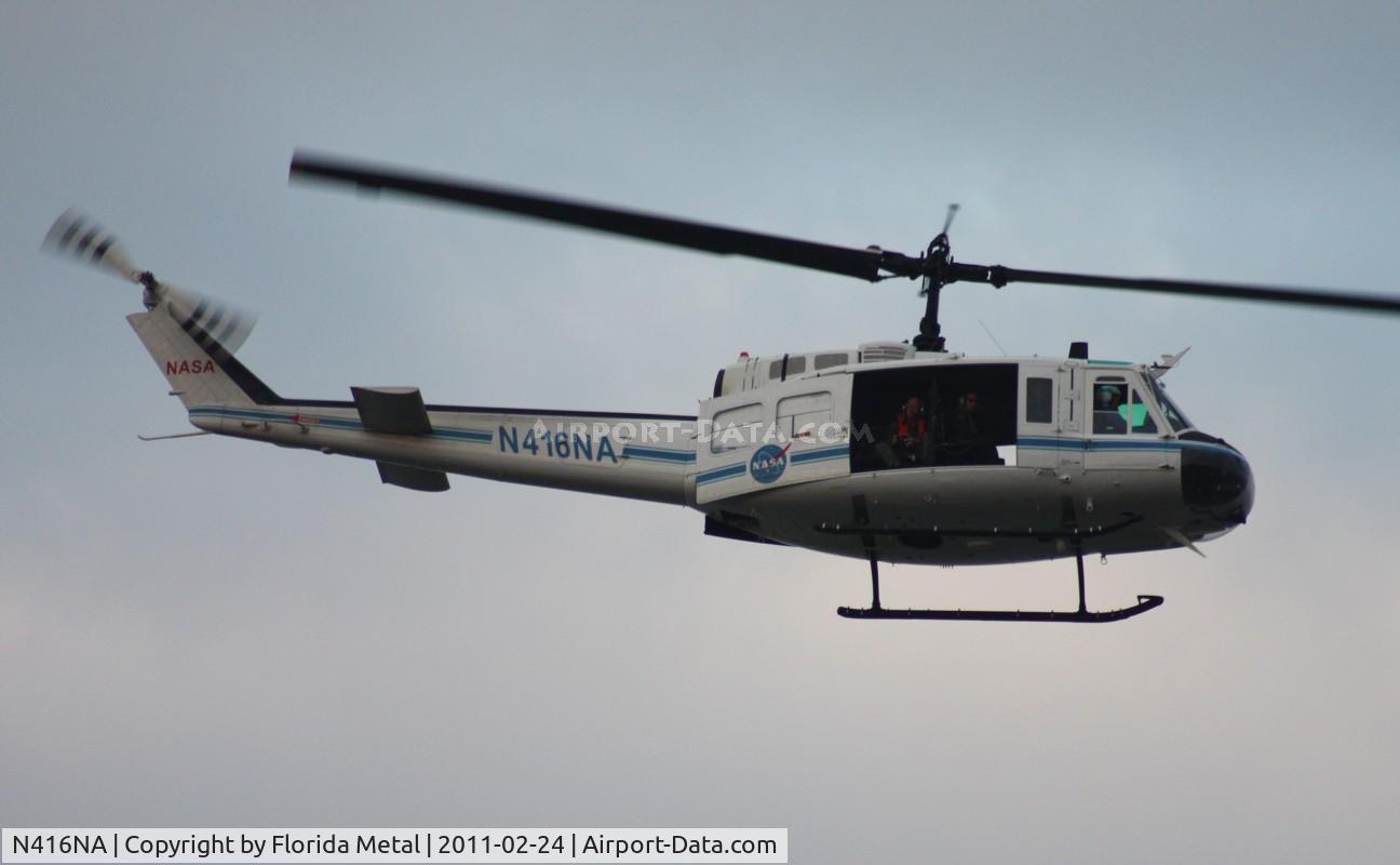 N416NA, Bell UH-1B C/N 622064, NASA UH-1B flying along Indian River at Titusville