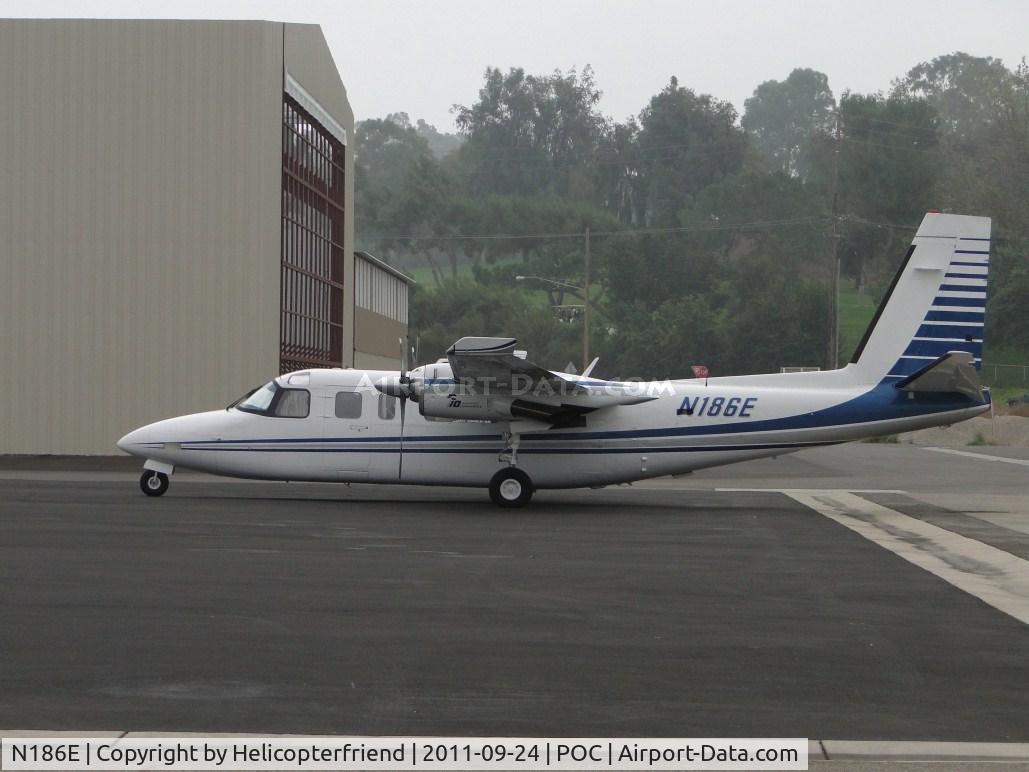 N186E, 1979 Rockwell International 690B C/N 11566, Setting out under an overcast sky at Howard Aviation