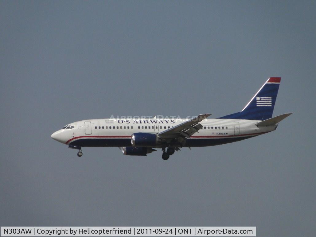 N303AW, 1988 Boeing 737-3G7 C/N 24010, On final for runway 26R