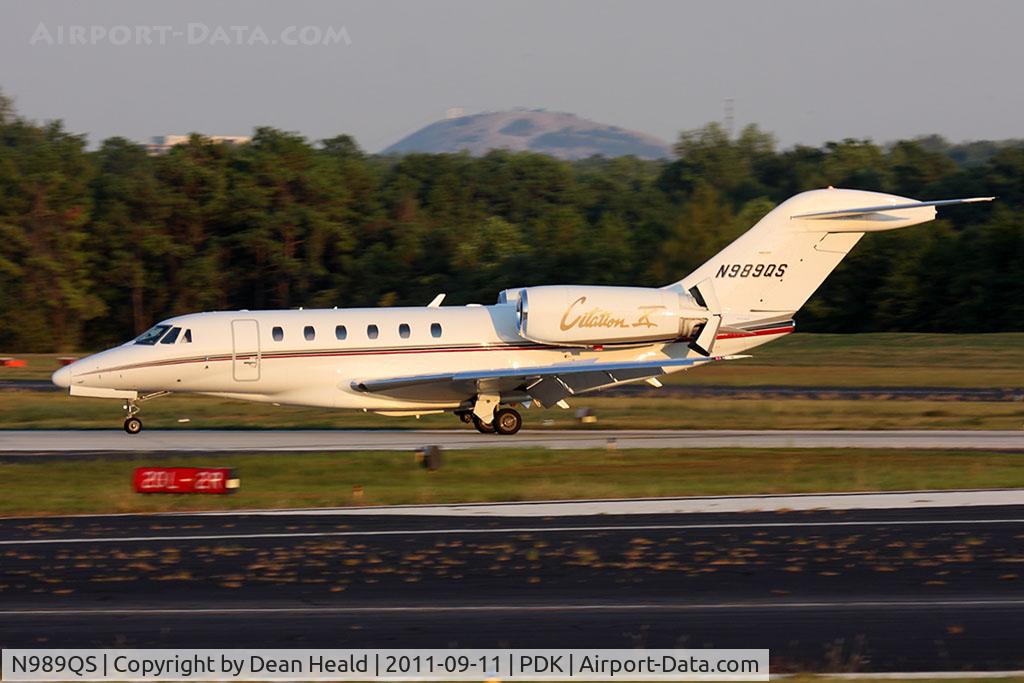N989QS, 1999 Cessna 750 Citation X Citation X C/N 750-0089, NetJets N989QS rolling out on RWY 2R after arrival from Tampa Int'l (KTPA). Stone Mountain can be seen in the background.