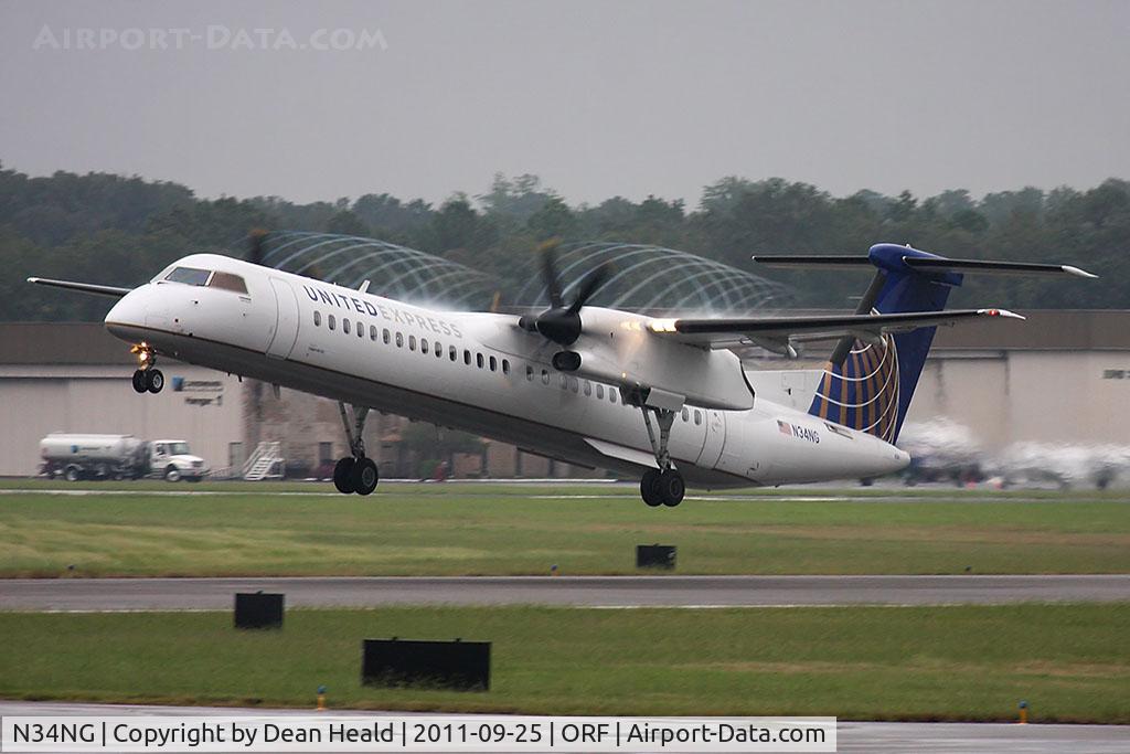 N34NG, 2010 Bombardier DHC-8-402 Dash 8 C/N 4340, United Express (Colgan Air) N34NG (FLT CJC4890) departing RWY 5 en route to Newark Liberty Int'l (KEWR) with condensation from the propeller blade tips.