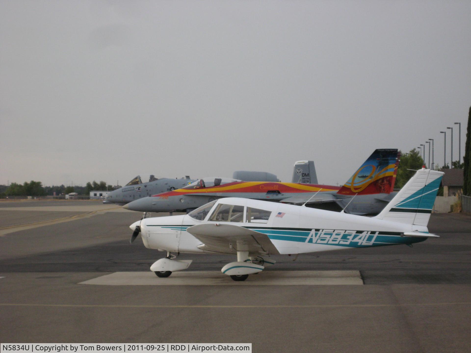 N5834U, 1969 Piper PA-28-140 Cherokee B C/N 28-26665, At Redding Air Show 2011 next to a Canadian Hornet and a USAF Warthog.