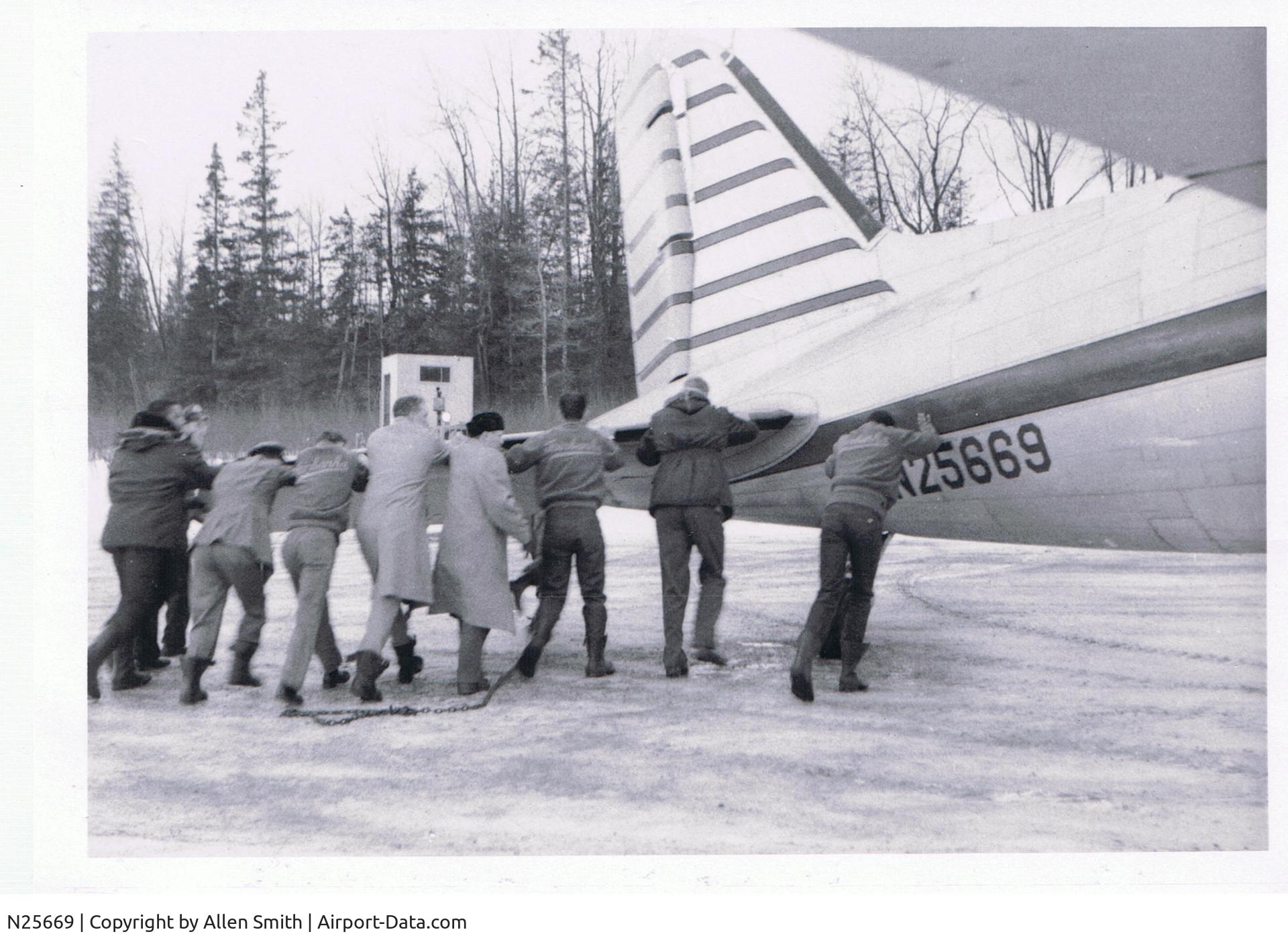 N25669, Douglas DC-3 C/N 2242, 1960  Seward Alaska.  Traveling with the Fairbanks High Basketball team, we went off the runway and had to push the plane back onto the runway.