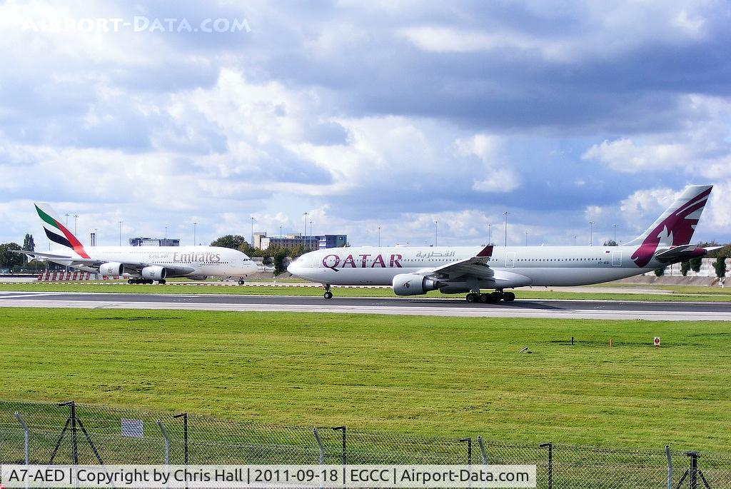 A7-AED, 2005 Airbus A330-302 C/N 680, Qatar A330 departing from RW23R as Emirates A380 A6-EDJ taxis to the hold