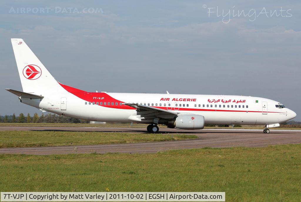 7T-VJP, 2001 Boeing 737-8D6 C/N 30208, About to depart EGSH after spray.