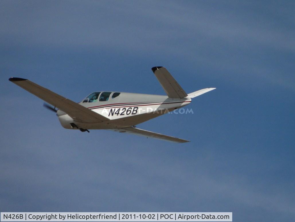 N426B, 1957 Beech A35 Bonanza C/N D-1647, Airbourne, wheels retracted and heading out westbound
