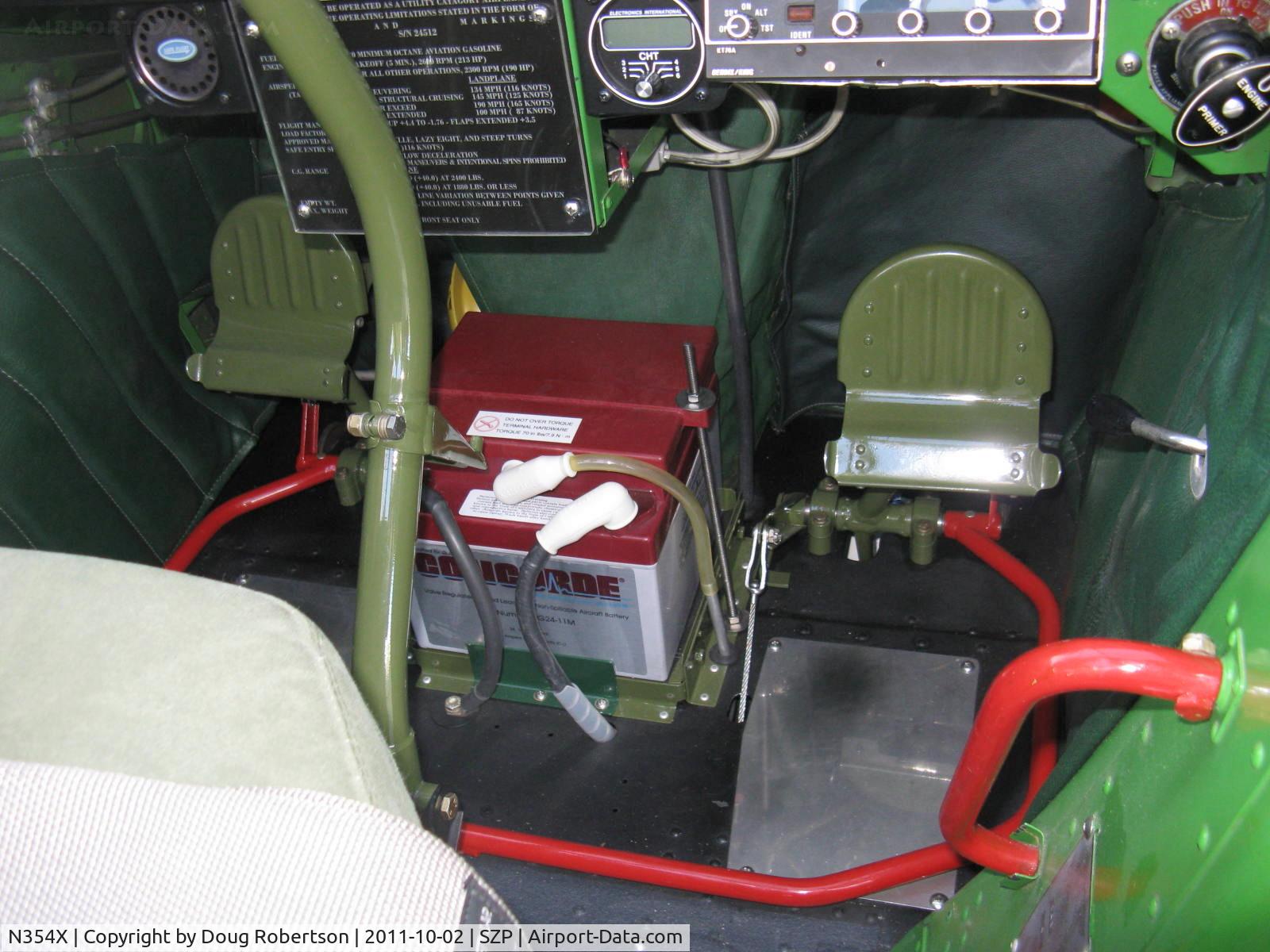 N354X, 1957 Cessna L-19E Bird Dog C/N 24512, 1957 Cessna L-19E BIRD DOG, Continental O-470-11B 213 Hp, aircraft battery between forward rudder pedals