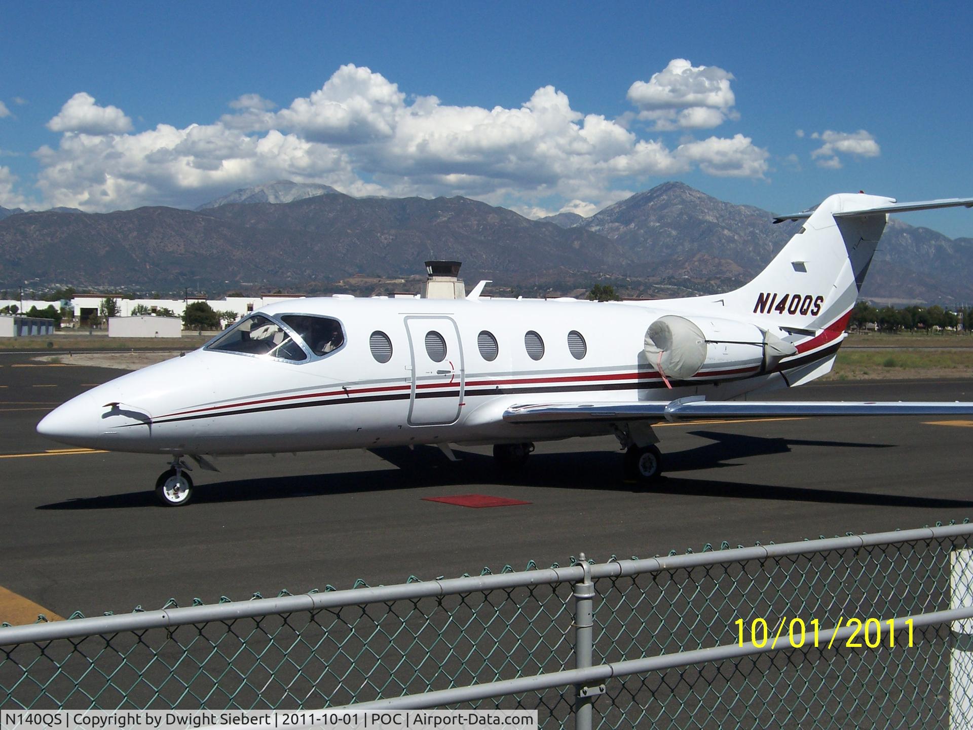 N140QS, 2005 Beech 400A Beechjet C/N RK-406, Parked in front of 