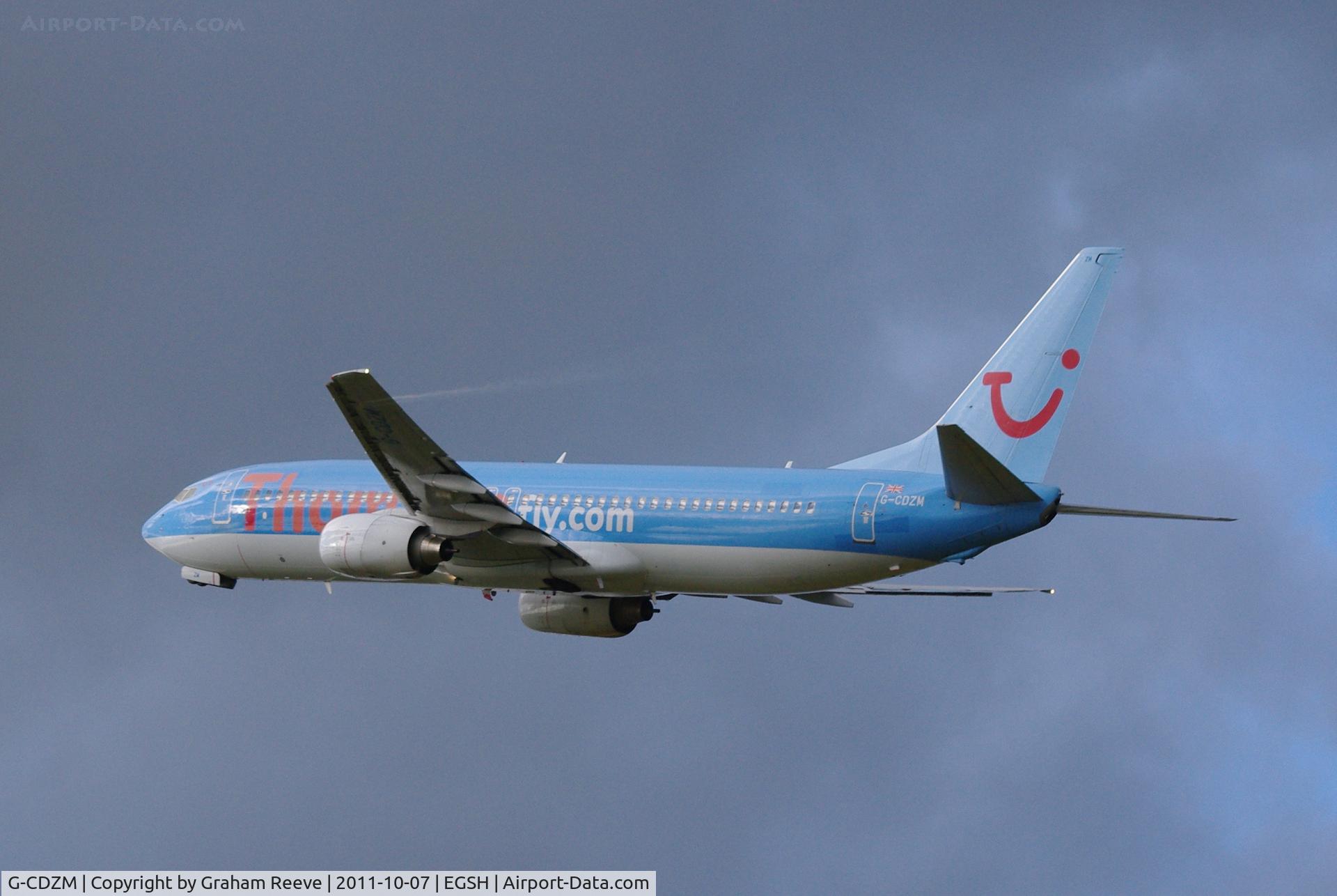 G-CDZM, 2000 Boeing 737-804 C/N 30466, Note the vapour coming from under the wing, inboard.