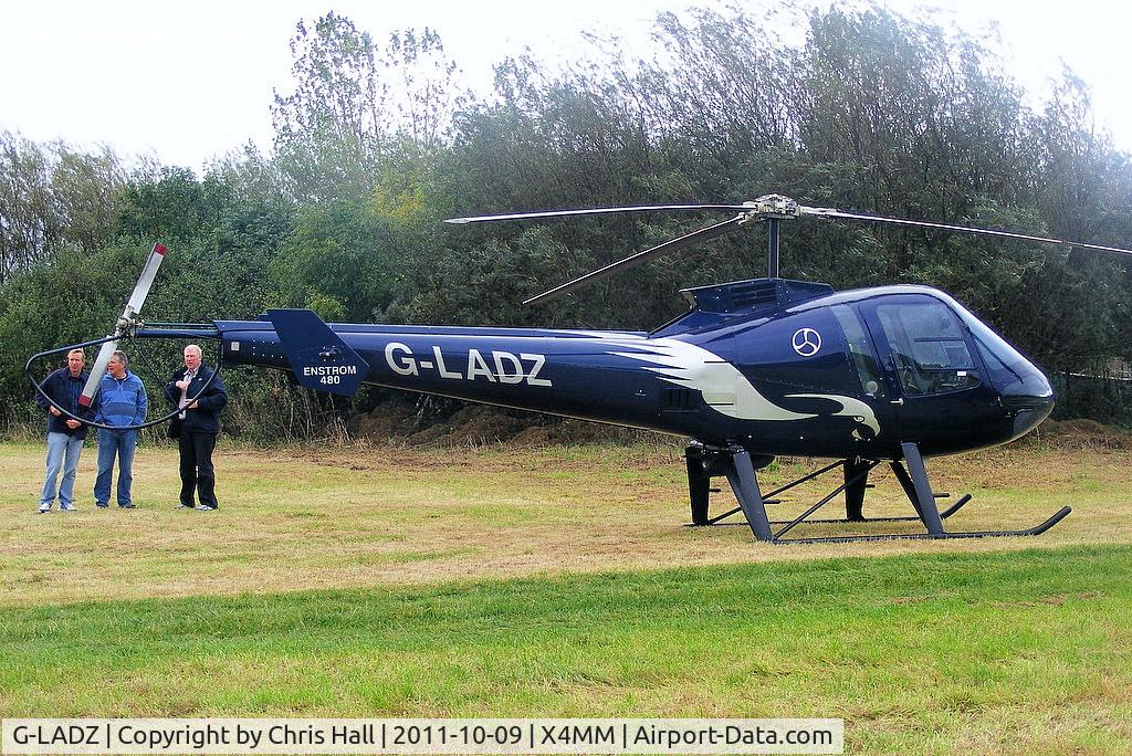 G-LADZ, 1993 Enstrom 480 C/N 5001, At a fly-in at Manley Mere, Cheshire. Organised by Helicentre Liverpool in aid of the North West Air Ambulance