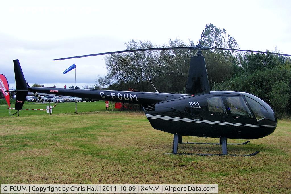 G-FCUM, 2007 Robinson R44 Raven II C/N 11723, At a fly-in at Manley Mere, Cheshire. Organised by Helicentre Liverpool in aid of the North West Air Ambulance
