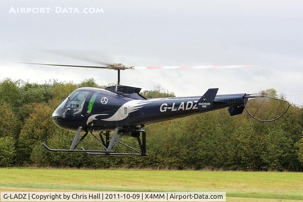 G-LADZ, 1993 Enstrom 480 C/N 5001, At a fly-in at Manley Mere, Cheshire. Organised by Helicentre Liverpool in aid of the North West Air Ambulance