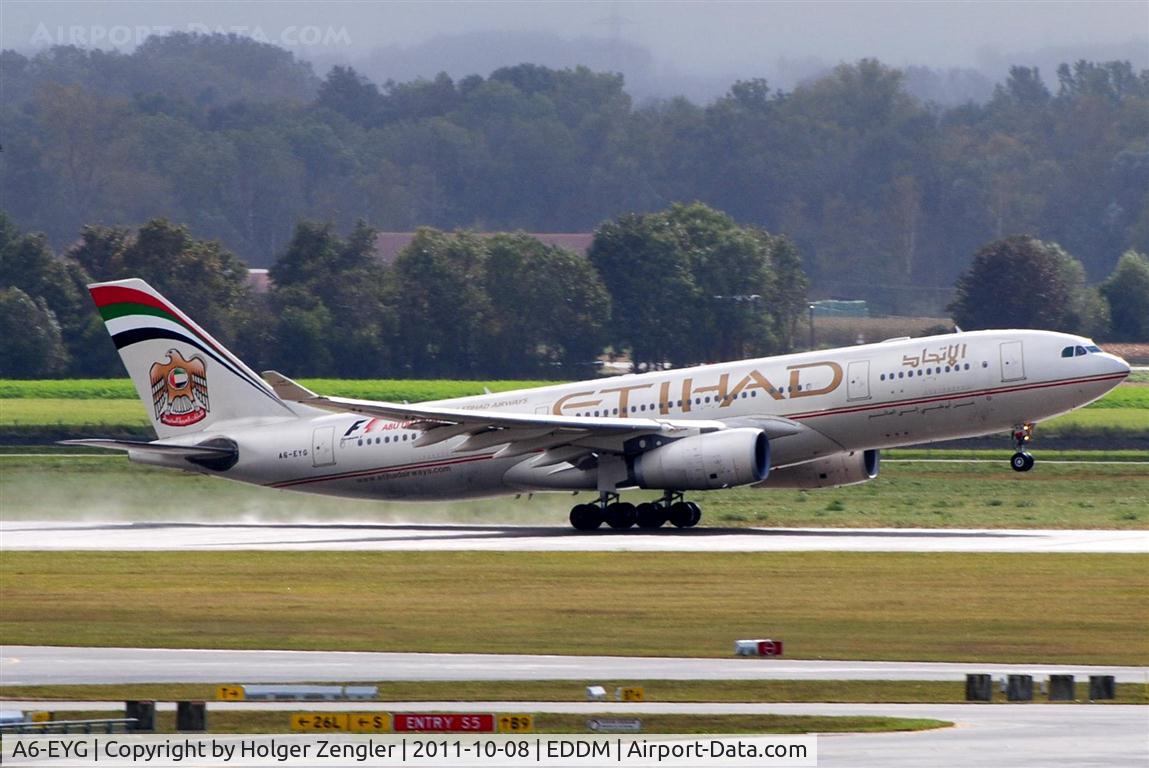 A6-EYG, 2006 Airbus A330-243 C/N 724, Take-off on wet rwy 26L.....