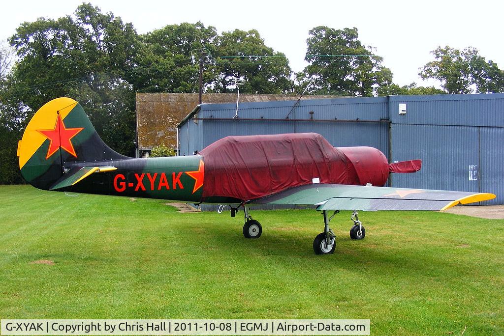 G-XYAK, 1989 Bacau Yak-52 C/N 899413, at Fullers Hill Farm, Little Gransden