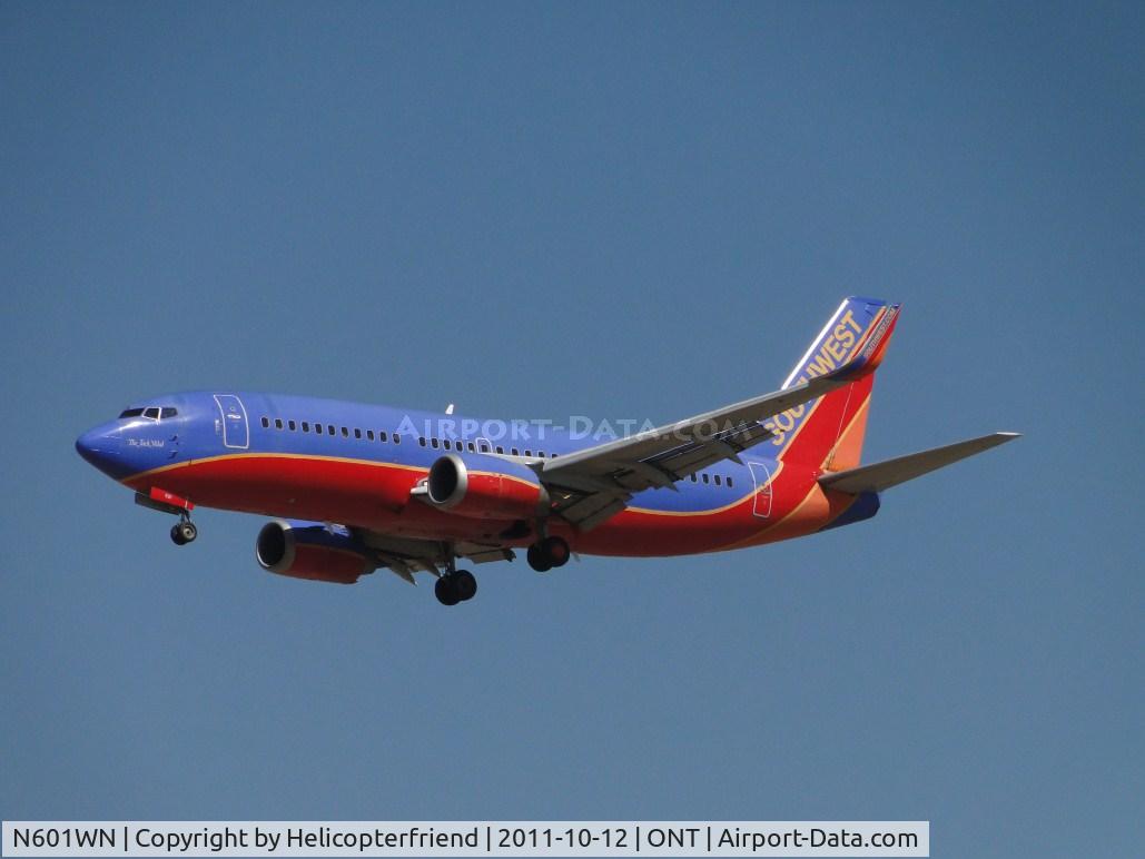 N601WN, 1995 Boeing 737-3H4 C/N 27695, On final for 26L. March 10, 1995 Southwest salutes Jack Vidal, our original VP Maintenance, by dedicating a plane in his name for recognition of 24 years of service and leadership
