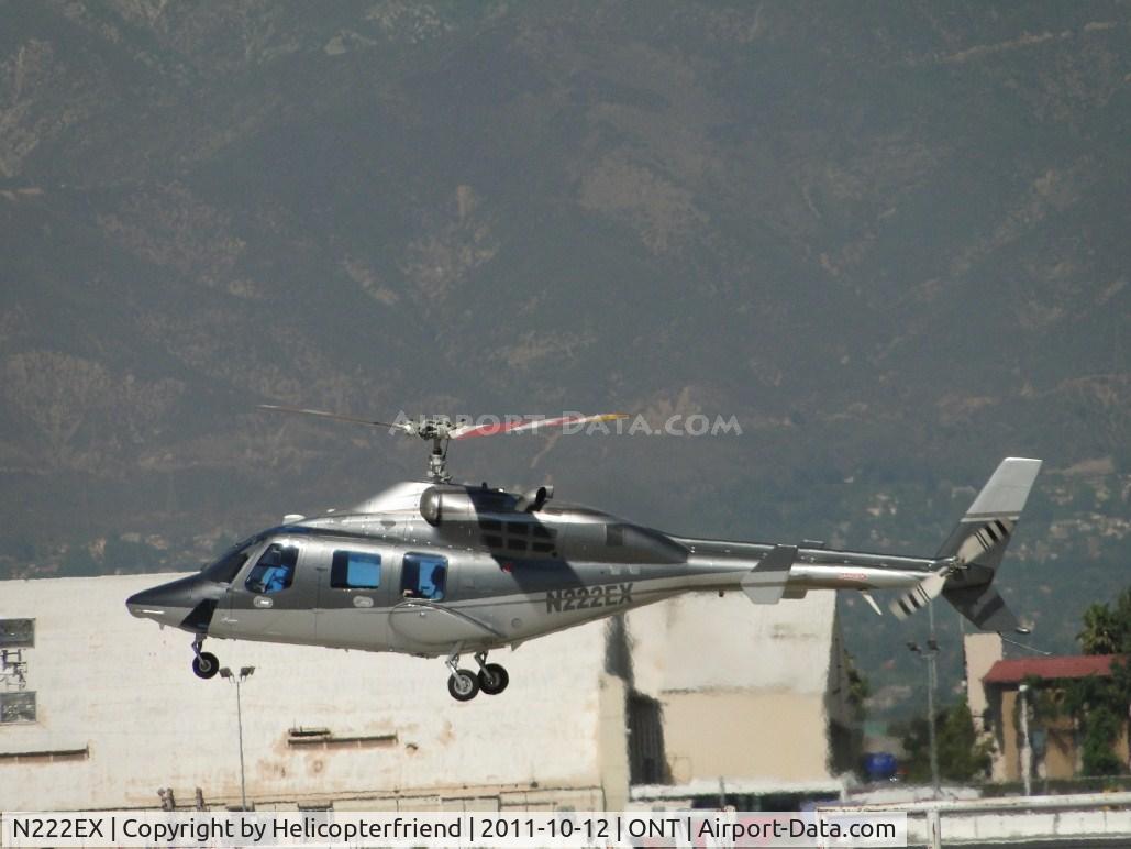 N222EX, 1980 Bell 222 C/N 47043, Lifting off westbound