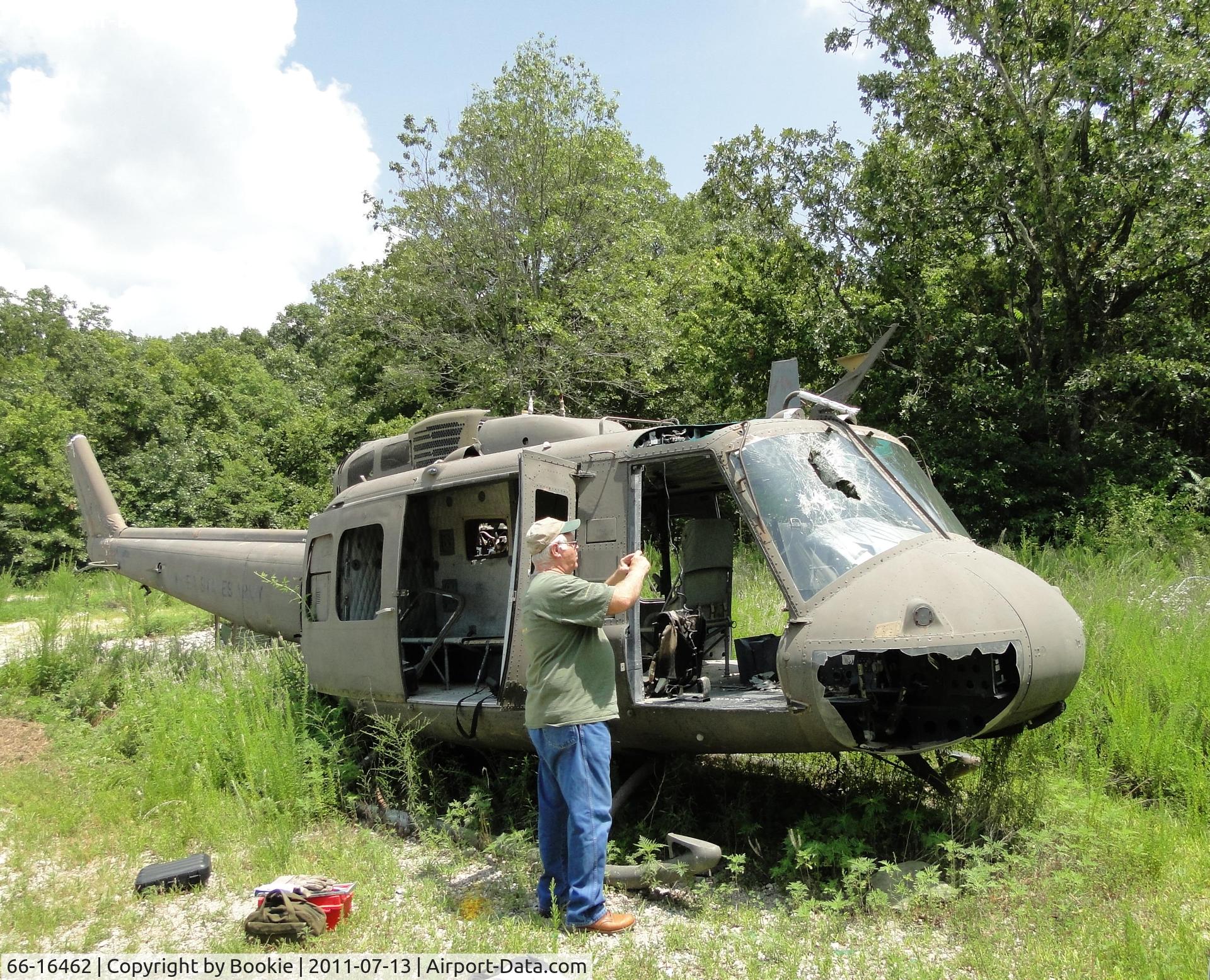 66-16462, 1966 Bell UH-1H Iroquois C/N 8656, Photo of me taking a photo of the instrument panel.  The old girl had been heavily vandalized while serving static training purposes.  Some parts were obtained for display.  Ft. Leonard Wood