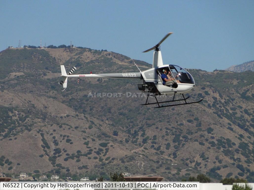 N6522, Robinson R22 Beta C/N 0522, Air taxiing down runway 8R to taxiway Cocco to enter the east helipad area