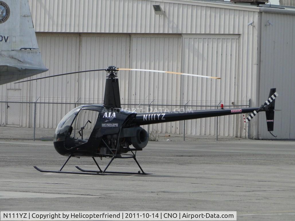 N111YZ, 1990 Robinson R22 BETA C/N 1622, Parked waiting for next student