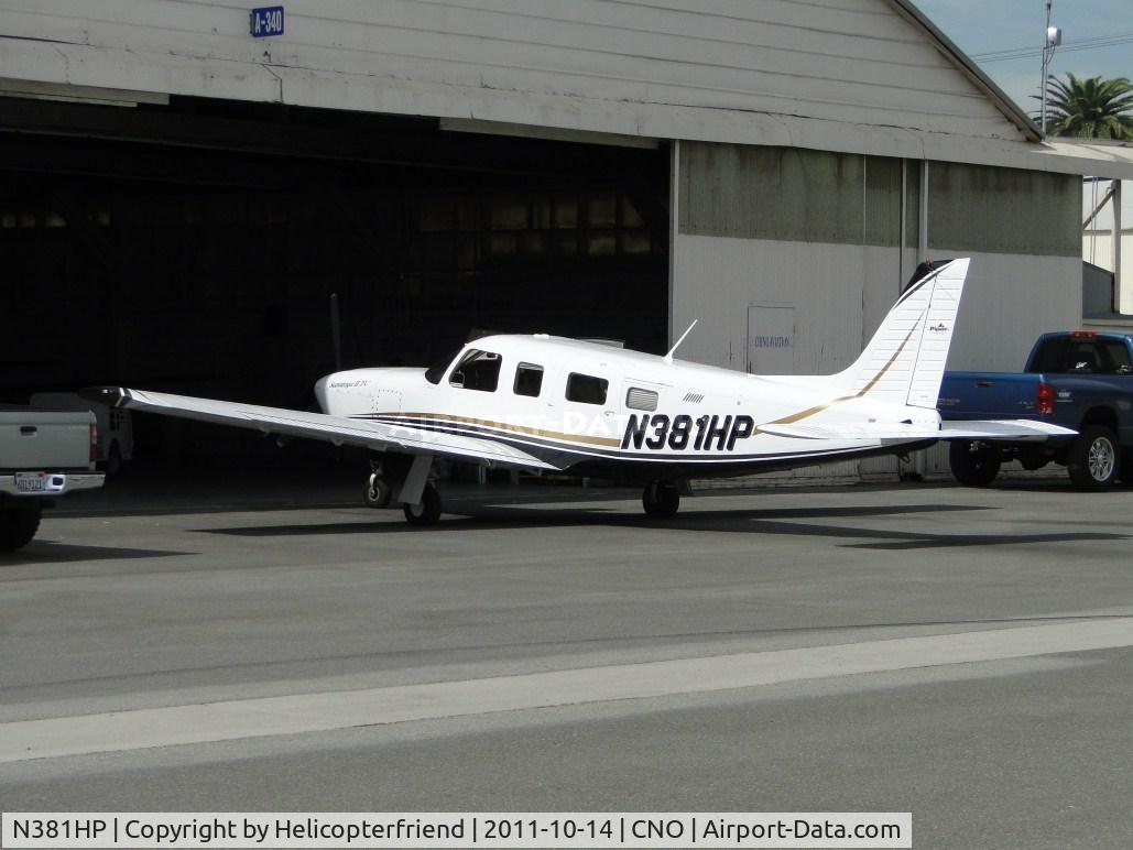 N381HP, 2005 Piper PA-32R-301T Turbo Saratoga C/N 3257374, Parked at a hanger