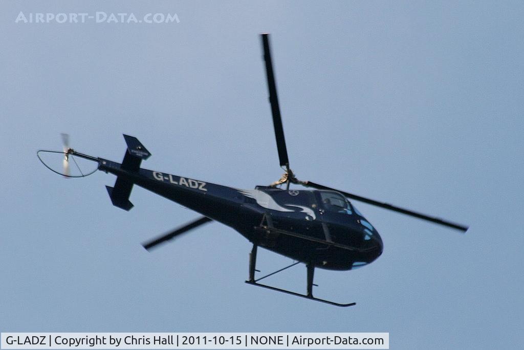 G-LADZ, 1993 Enstrom 480 C/N 5001, Barton based Enstrom 480 over Oulton Park race course
