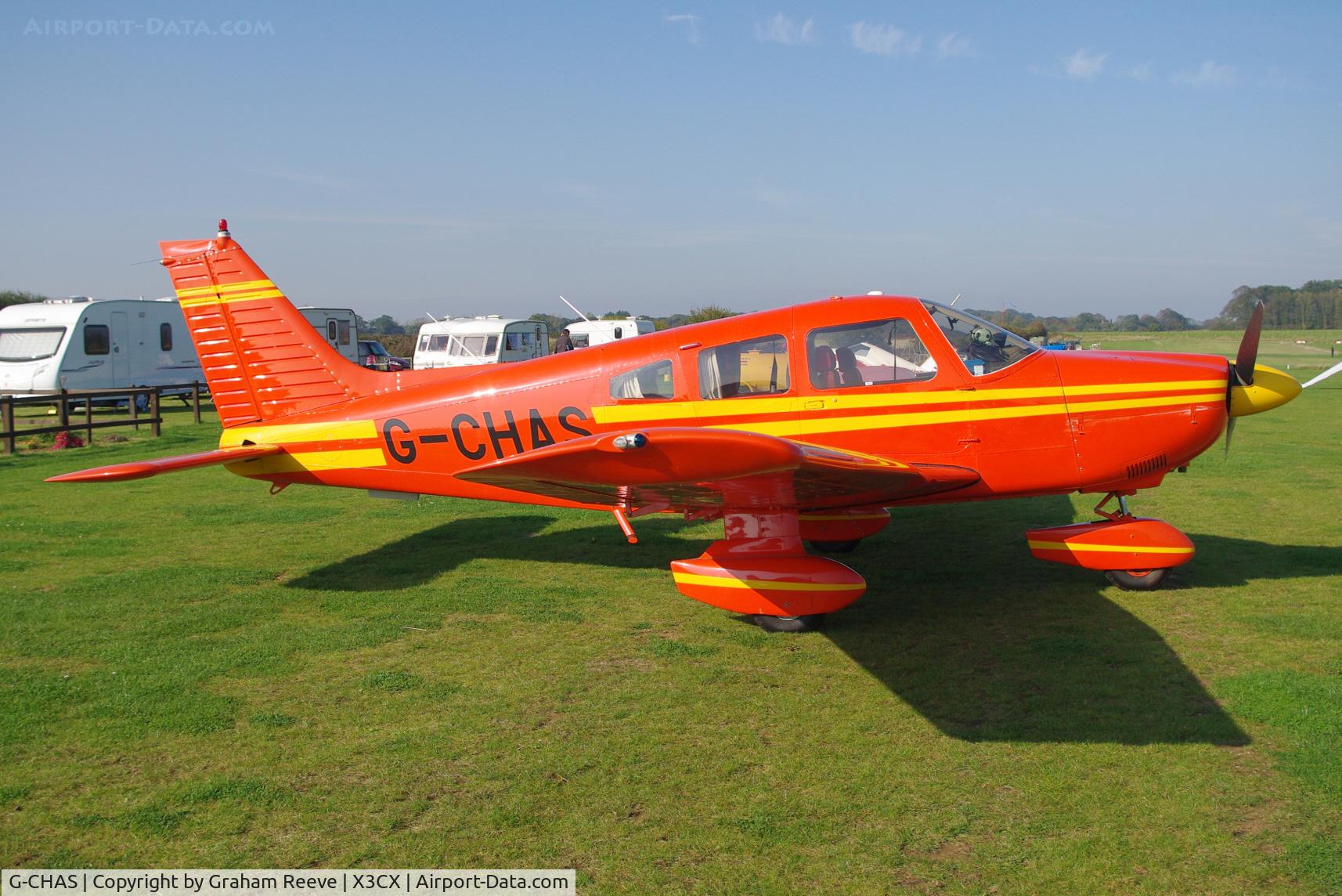 G-CHAS, 1980 Piper PA-28-181 Cherokee Archer II C/N 28-8090325, Parked in the sun.