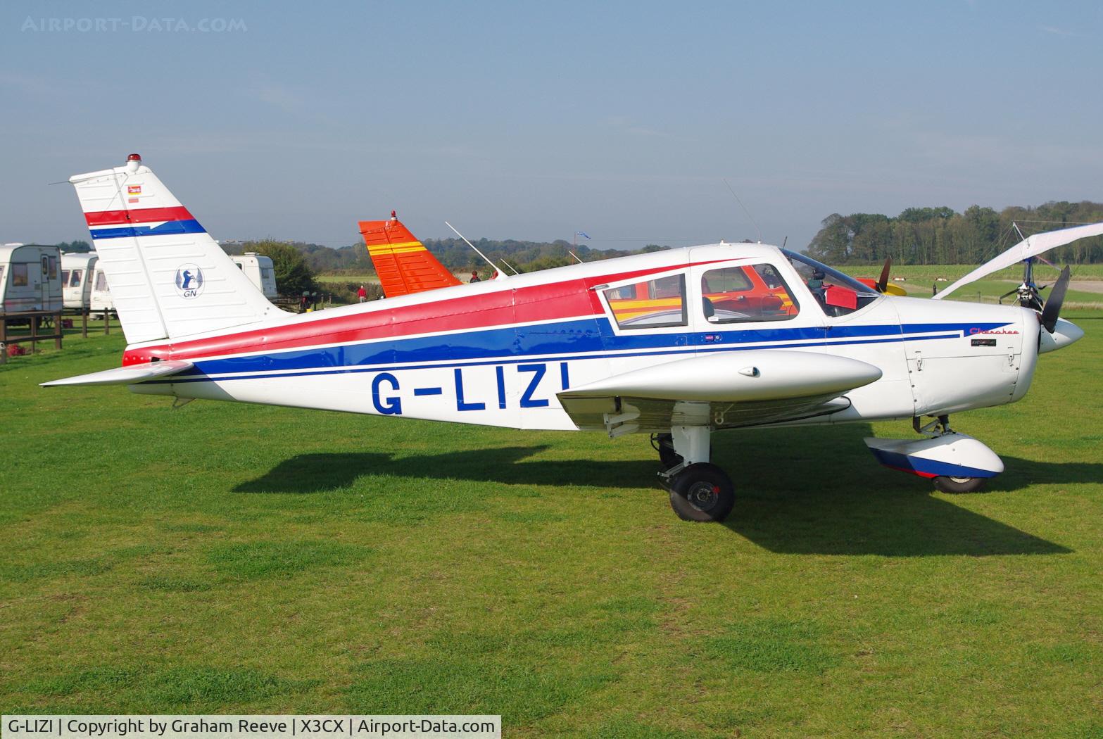 G-LIZI, 1961 Piper PA-28-160 Cherokee Cherokee C/N 28-52, Parked in the sun.