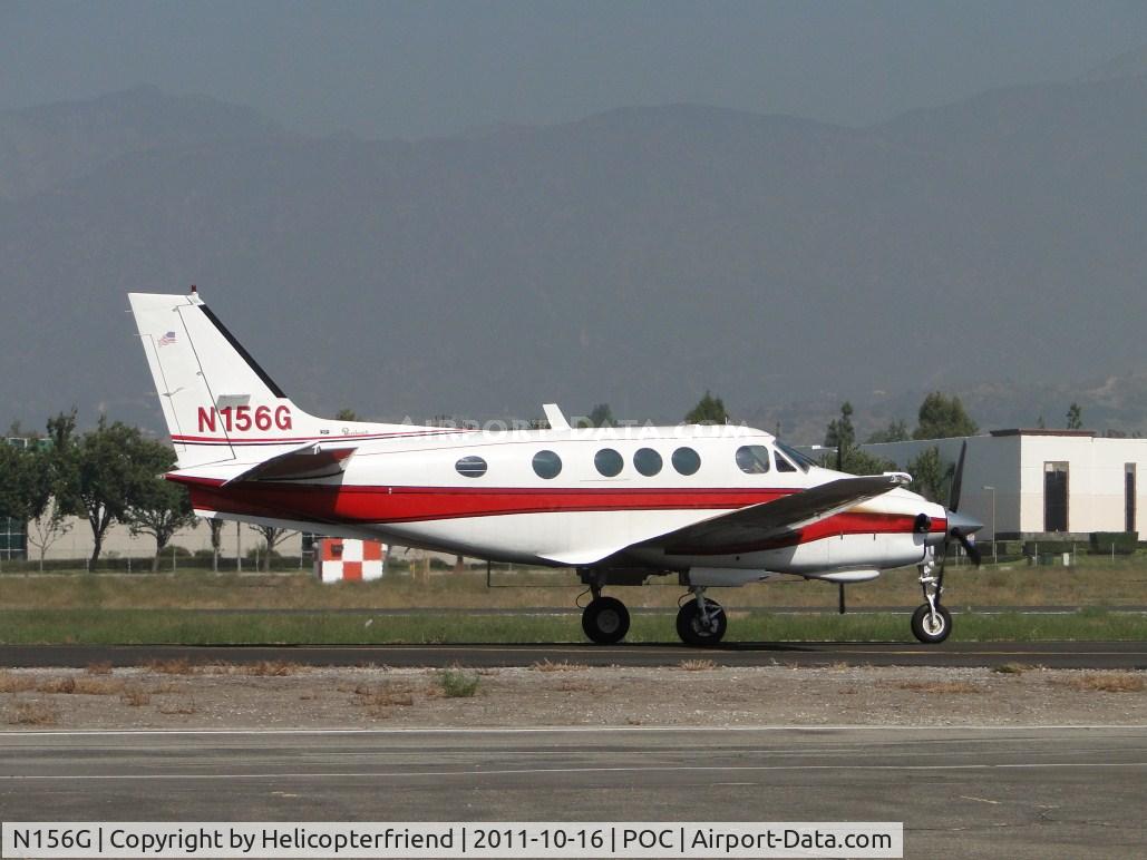 N156G, 1975 Beech E-90 King Air C/N LW-156, Visit complete, taxiing to runway 26L
