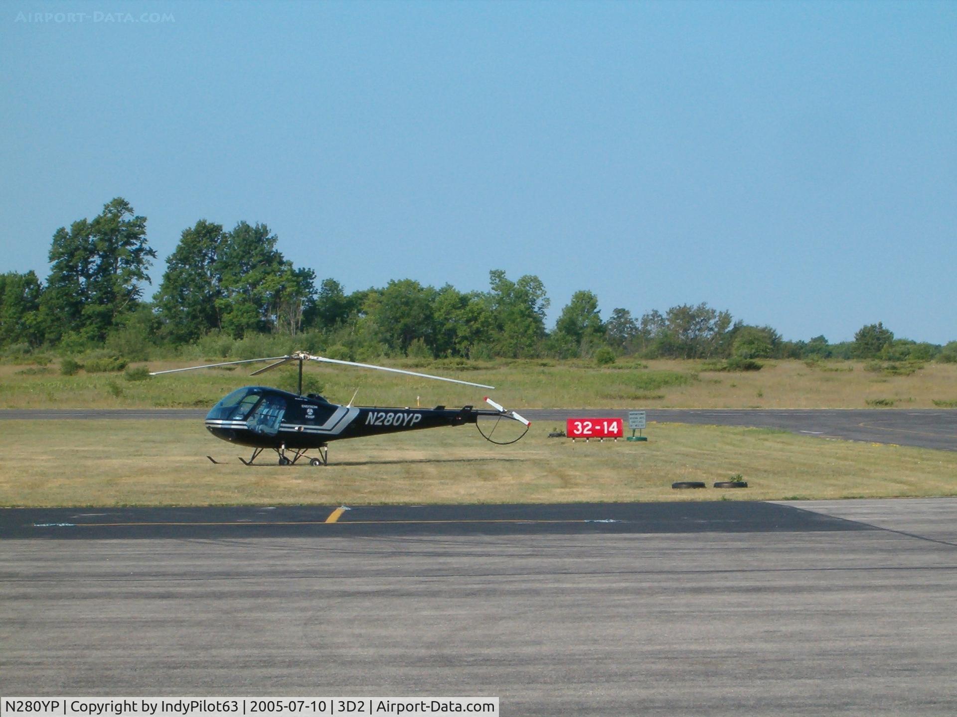 N280YP, 2003 Enstrom F-28F Falcon C/N 815, An Enstrom helicopter on the tarmac.