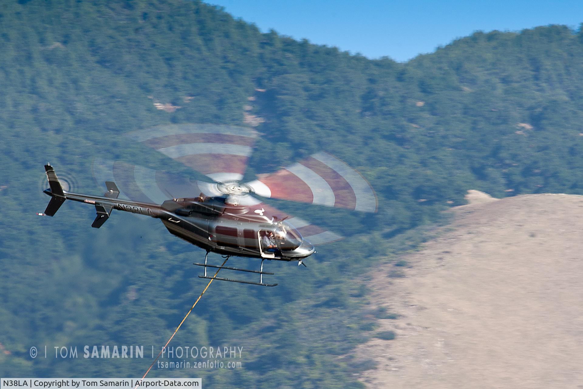 N38LA, 1998 Bell 407 C/N 53286, N38LA works in the Cuesta Range of San Luis Obispo County on October 19, 2011.