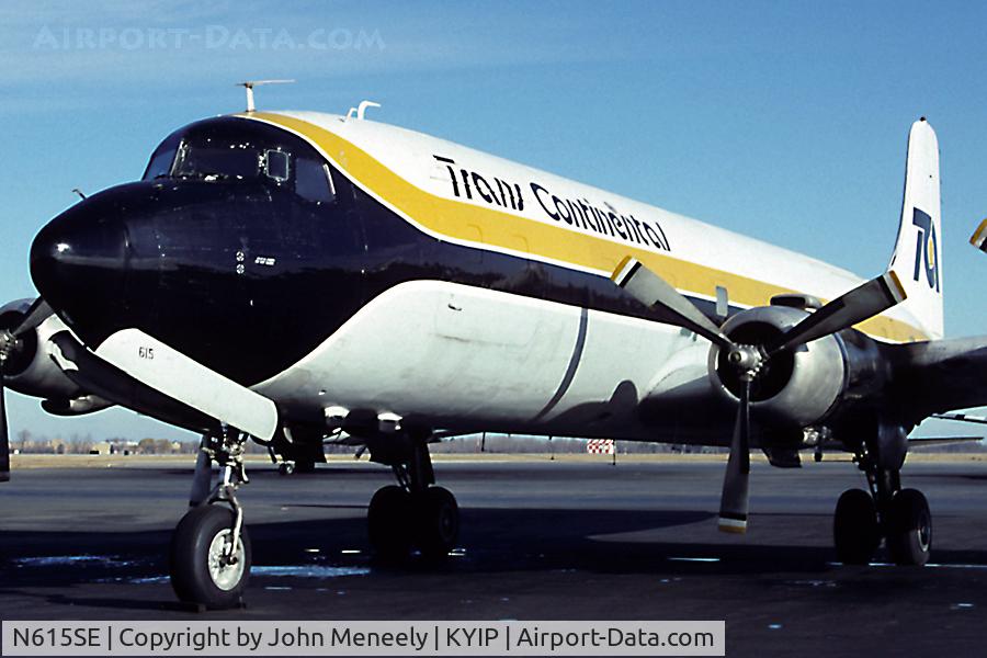 N615SE, 1951 Douglas DC-6A C/N 43296, Trans Continental DC-6 waiting for its next load of freight. Scanned from a slide. Taken in Nov. 1990 - exact date unknown.