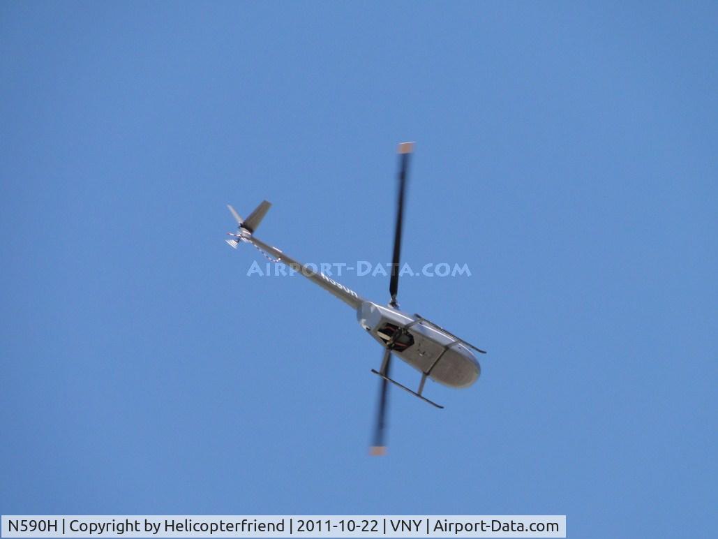 N590H, 2008 Robinson R44 Raven II C/N 12474, Over flying the airport eastbound