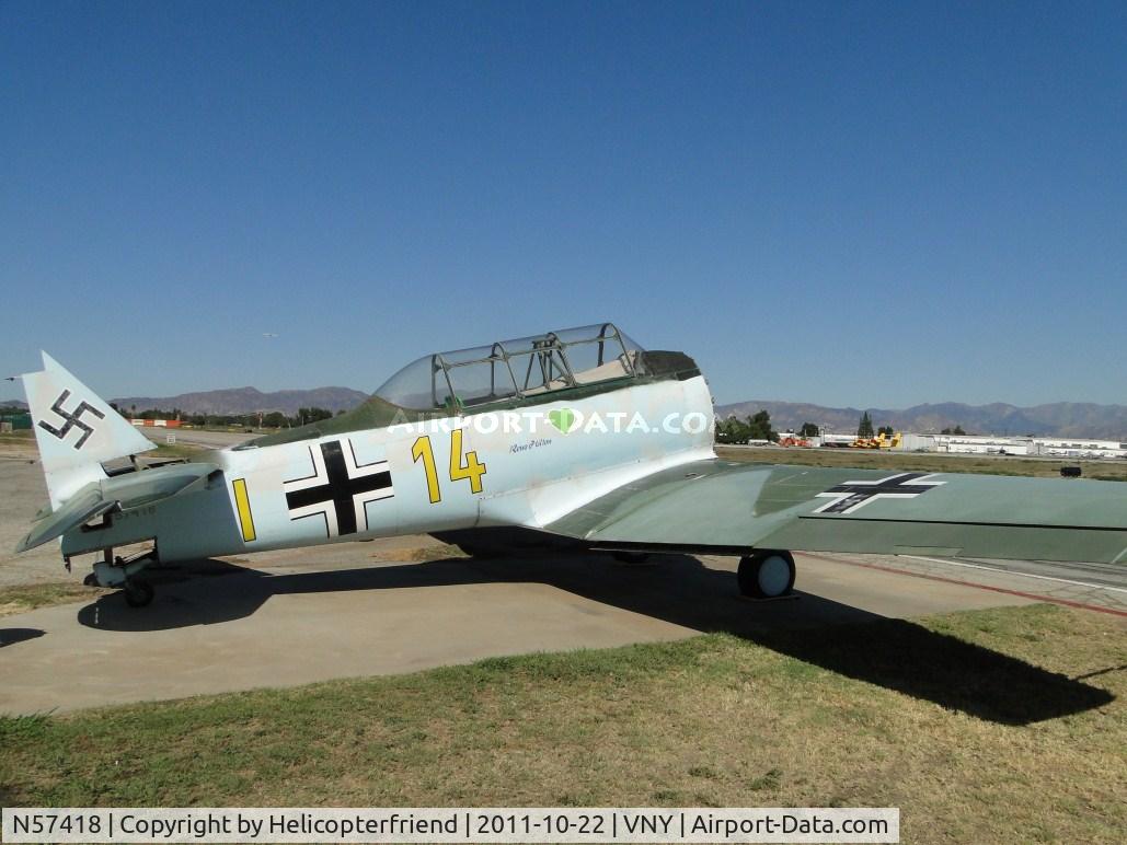 N57418, 1942 North American AT-6B Texan C/N 84-7748, Parked at Condor Squadron and being worked on