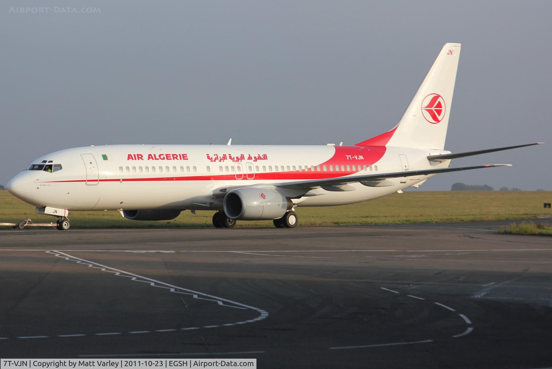 7T-VJN, 2001 Boeing 737-8D6 C/N 30206, Being towed from Air livery after spray.
