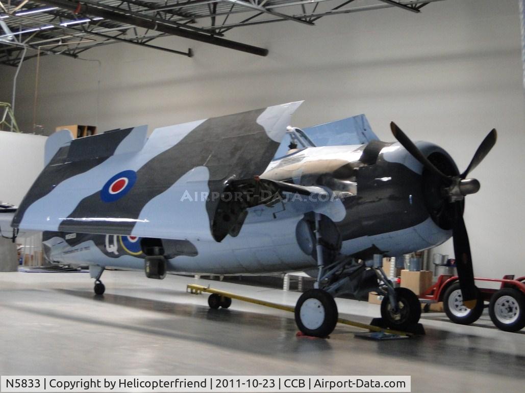 N5833, 1945 General Motors (Grumman) FM-2 Wildcat C/N 5833, Tucked away in the hanger with wings folded