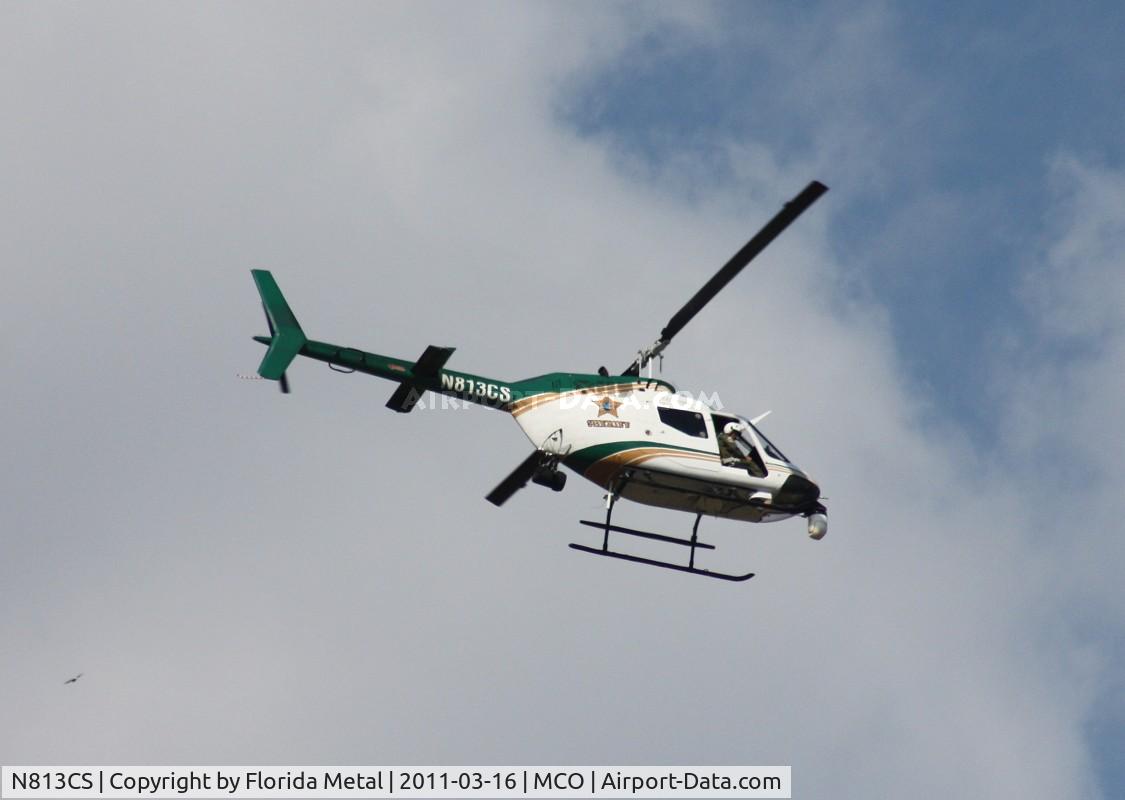 N813CS, 1971 Bell OH-58C Kiowa C/N 41674, Orange County Sherriff on patrol, his presence shut down the approach for 18R and 18L at MCO for about 40 min, while all MCO arrivals at that point went to 17L and 17R so all I had to see was this guy from my Starbucks spotting area