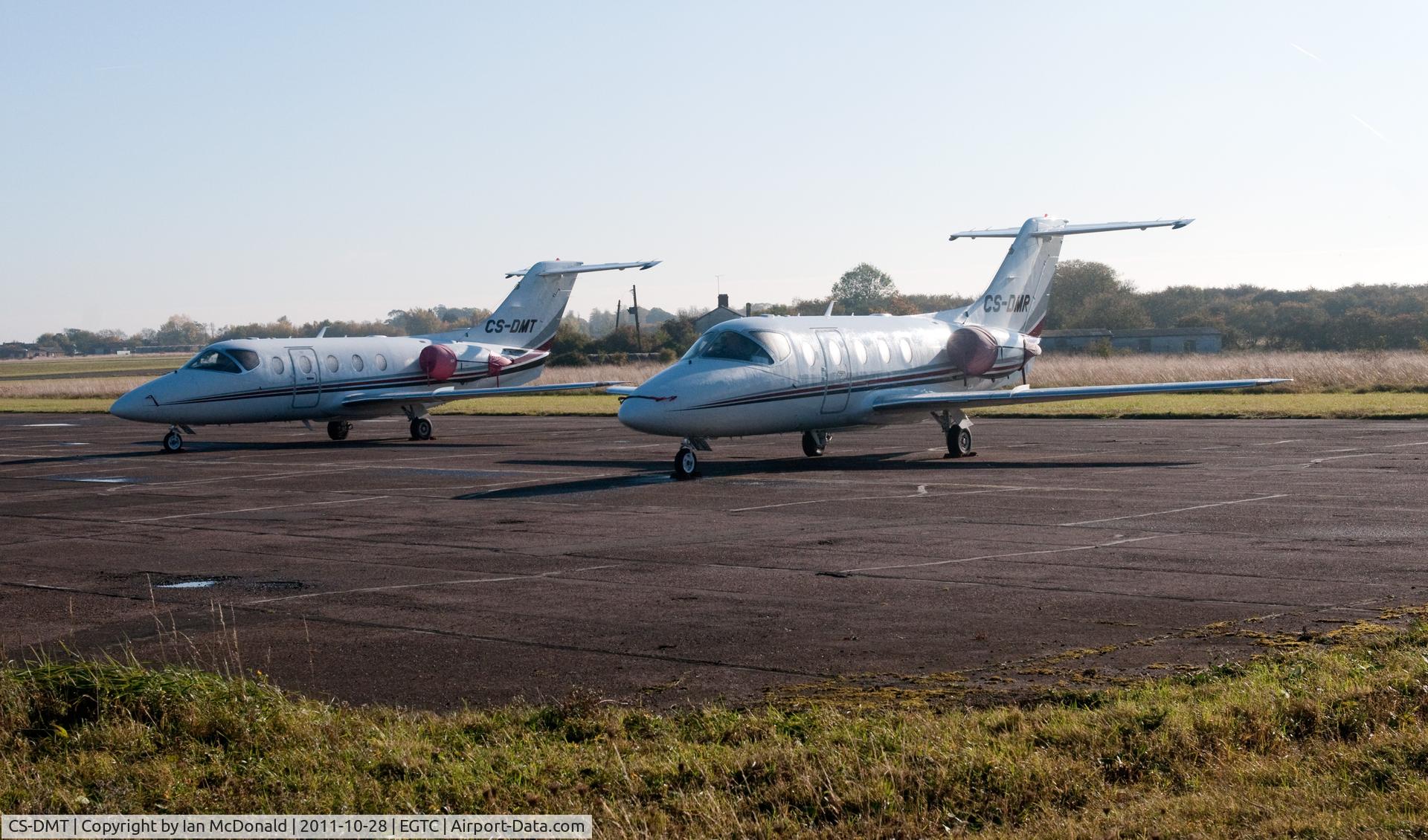 CS-DMT, 2007 Hawker Beechcraft 400A Beechjet Beechjet C/N RK-532, CS-DMT & CS-DMR parked up in a far corner of Cranfield Aerodrome.