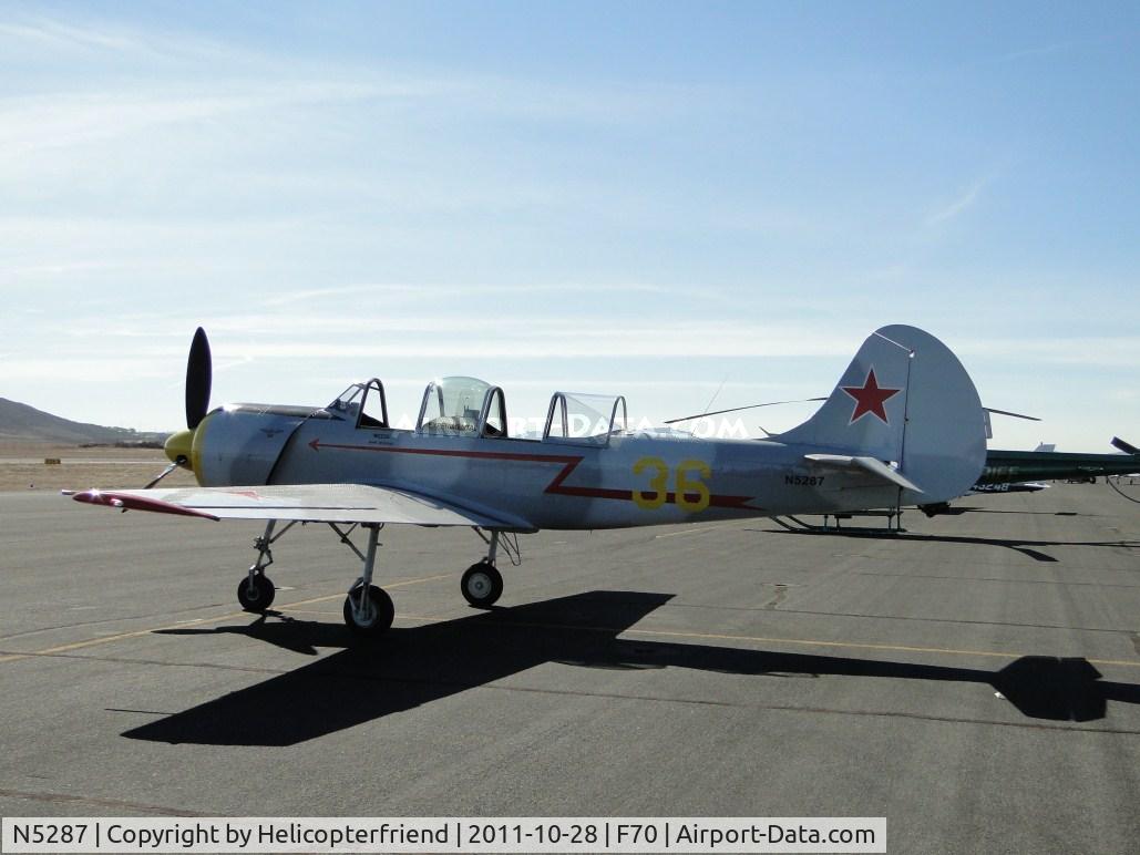 N5287, 1987 Yakovlev Yak-52 C/N 877509, Parked with N85YK