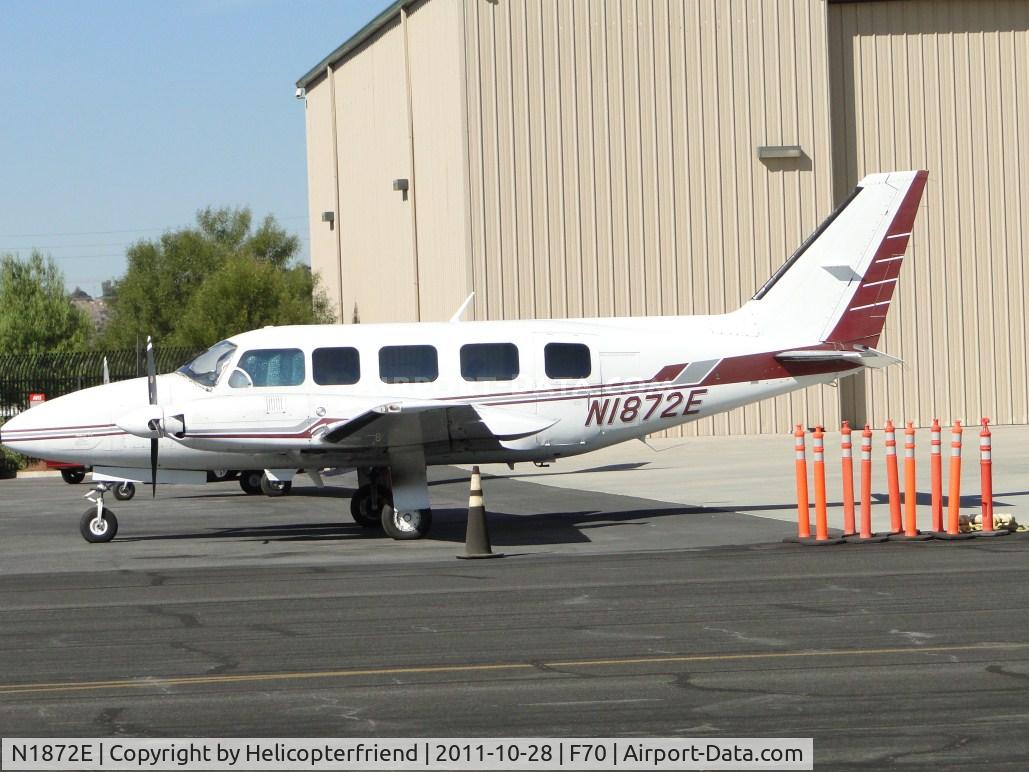 N1872E, 1980 Piper PA-31-350 Chieftain C/N 31-8052114, Parked behind the barricades near the hanger