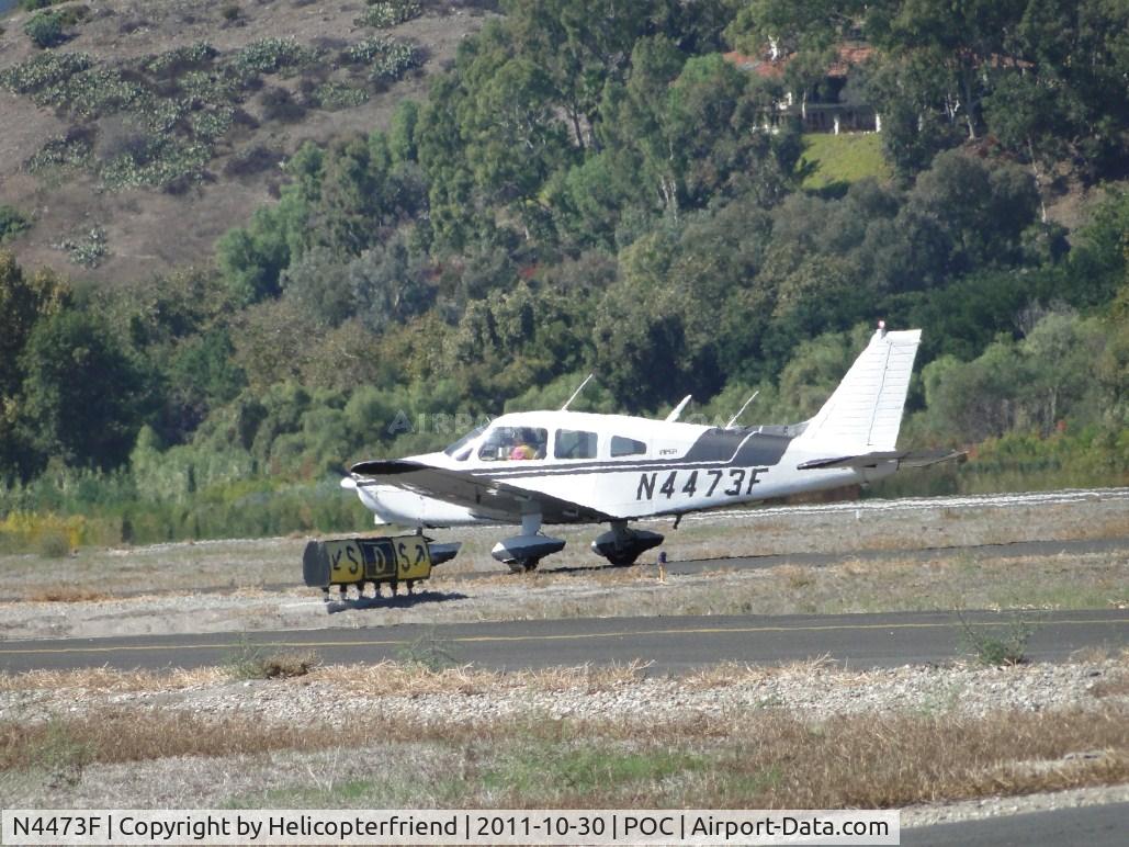 N4473F, 1976 Piper PA-28-151 C/N 28-7715035, Waiting permission to taxi onto taxiway Sierra at taxiway Delta