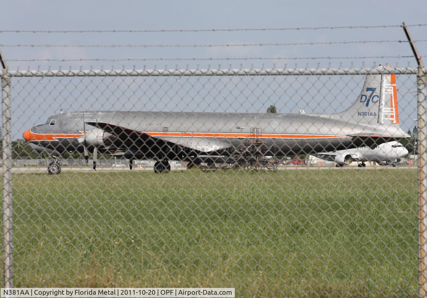 N381AA, 1956 Douglas DC-7BF C/N 44921, DC-7 painted in American colors - will get better shot next time I go.  I was kinda paranoid about taking pictures thru fences when I set off a perimeter alarm at FXE earlier that day.