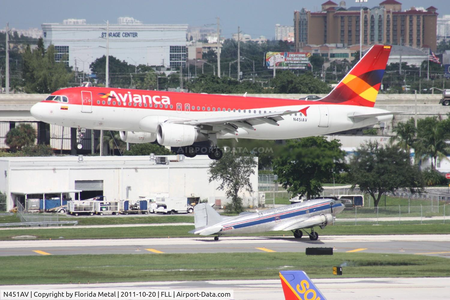 N451AV, 2009 Airbus A320-214 C/N 4051, New meets old - Avianca A320 with DC-3 waiting to take off