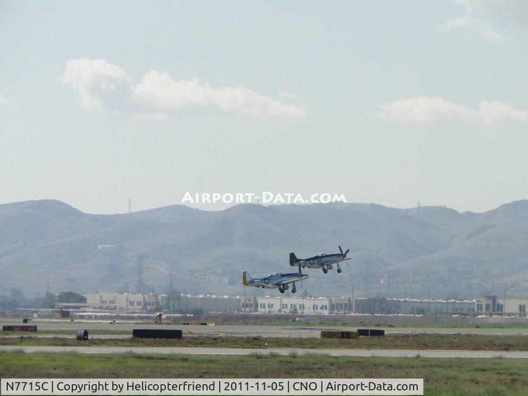N7715C, 1944 North American P-51D C/N 44-84961A (124-44817), Lead ship in formation take off from runway 26L, landing gear starting to be retracted