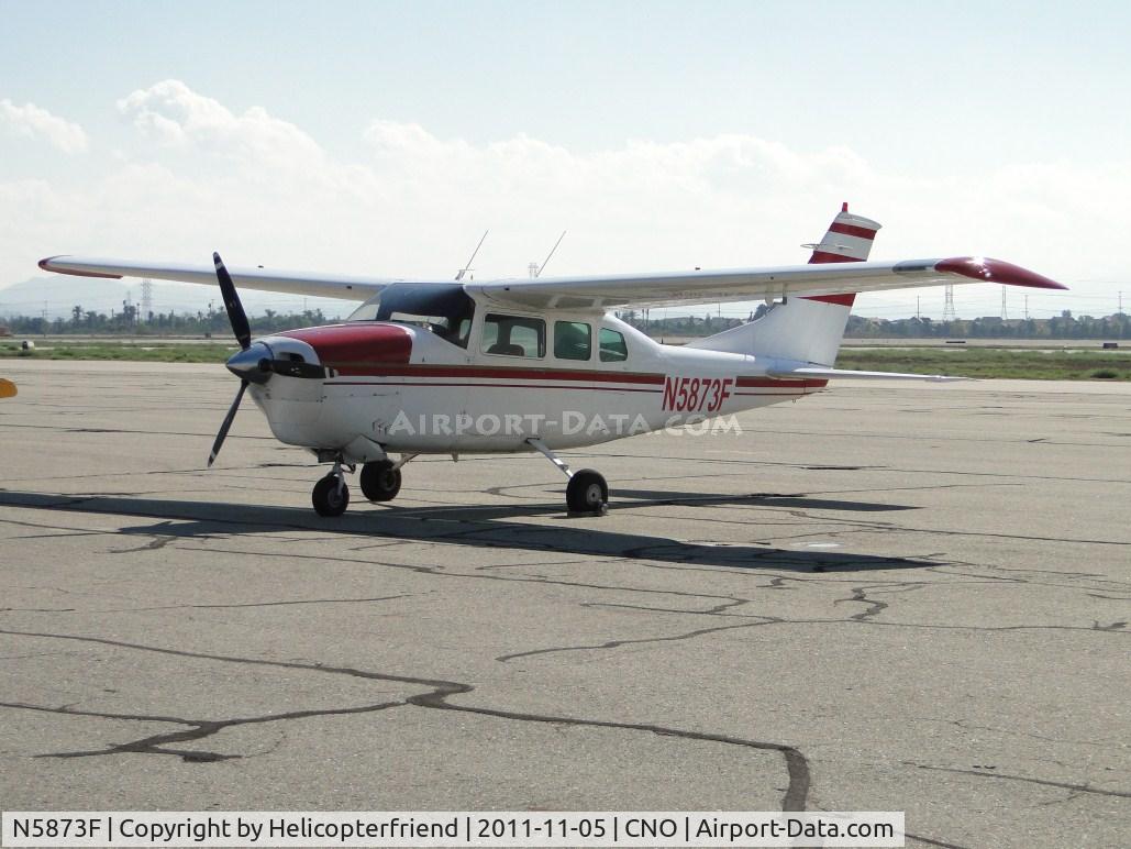 N5873F, 1967 Cessna 210G Centurion C/N 21058873, Parked north of runway 26R and west of the tower