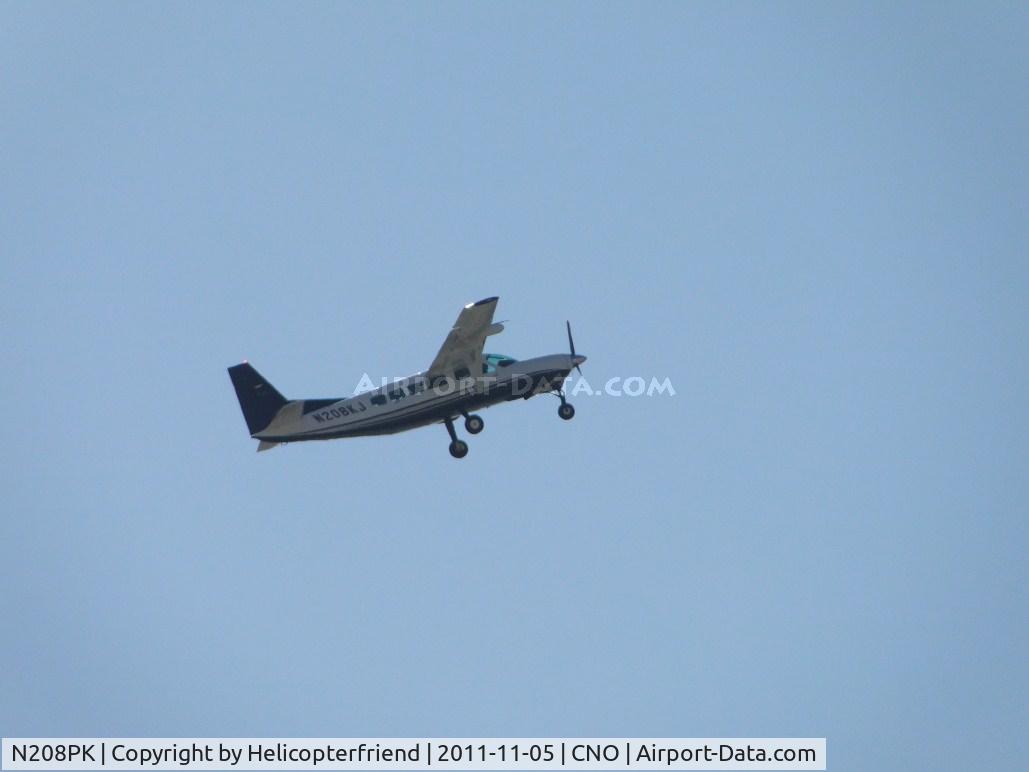 N208PK, 2005 Cessna 208B C/N 208B1143, Climbing out after take off