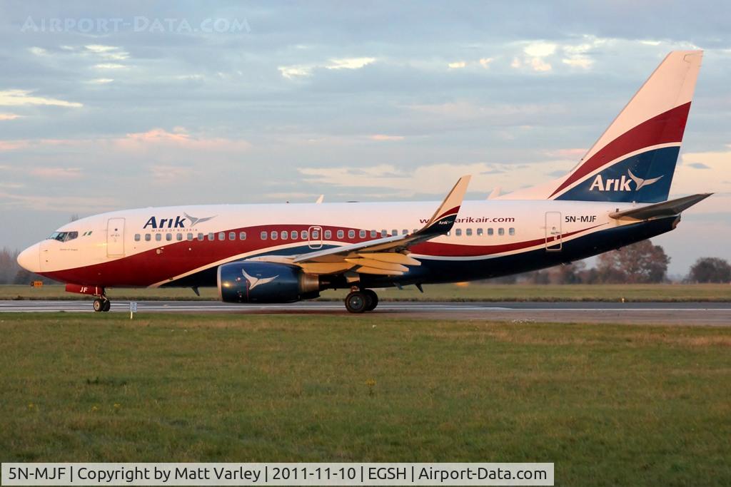 5N-MJF, Boeing 737-7GL C/N 34762/2427, Departing EGSH in the low evening sun.