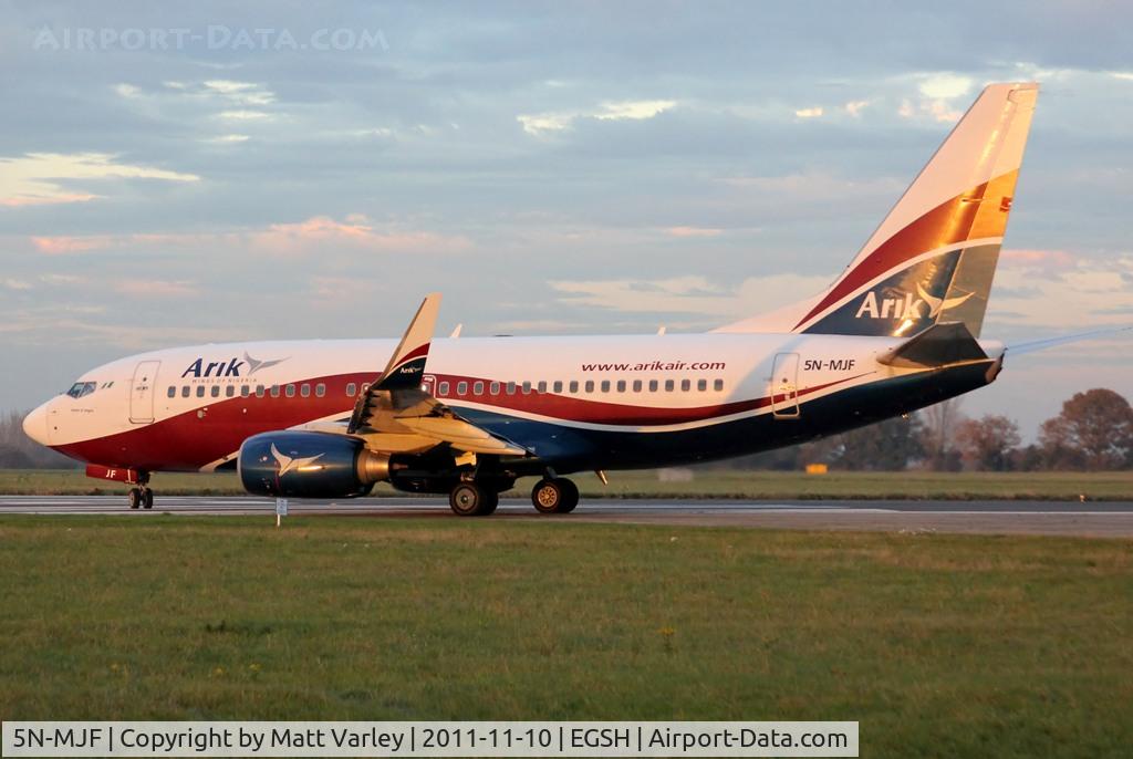 5N-MJF, Boeing 737-7GL C/N 34762/2427, Departing EGSH in the low evening sun.
