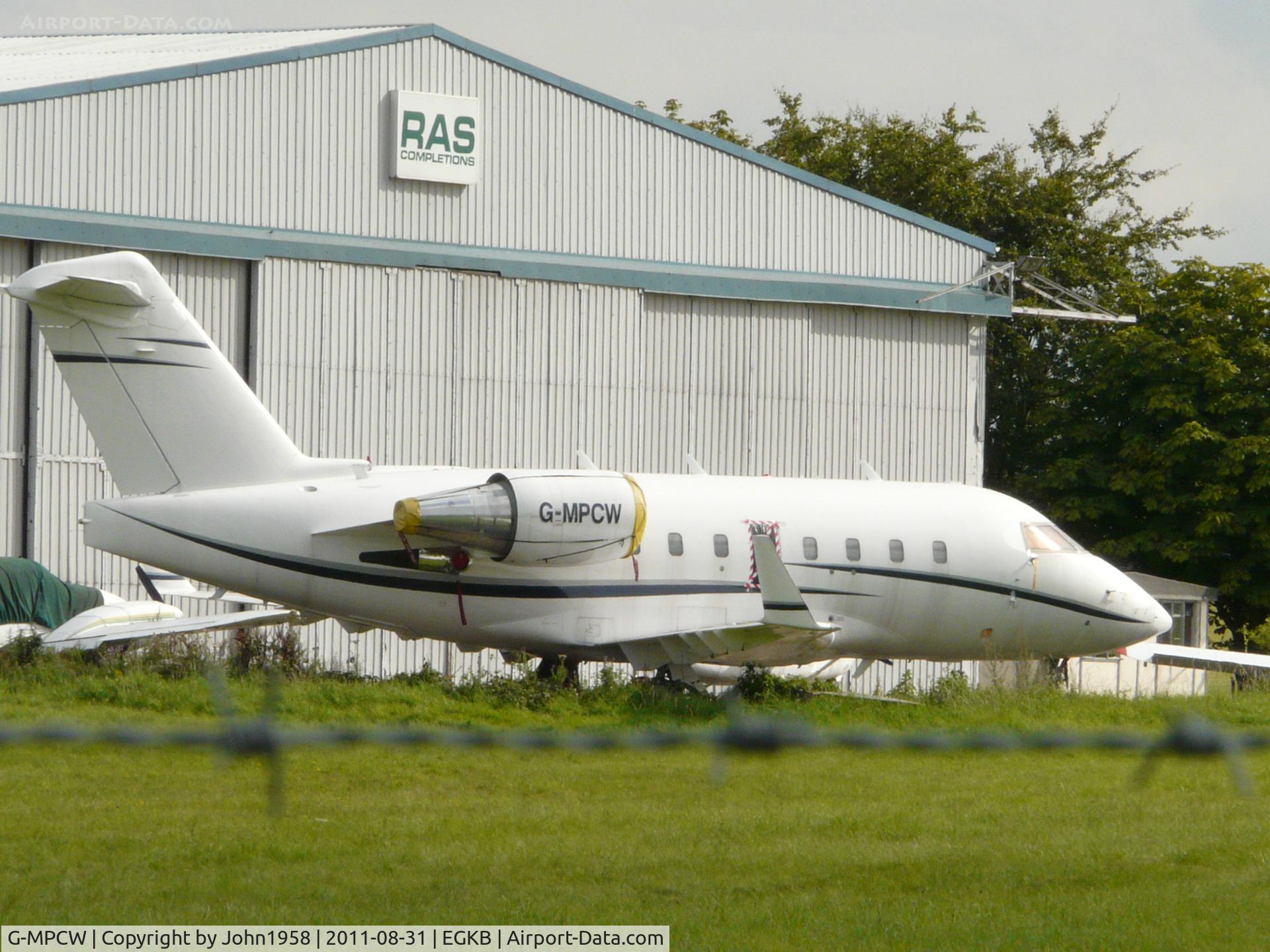 G-MPCW, 1999 Bombardier Challenger 604 (CL-600-2B16) C/N 5422, Looking a bit sorry for herself, awaiting her new registration of G-MPSP and hopefully some paint!